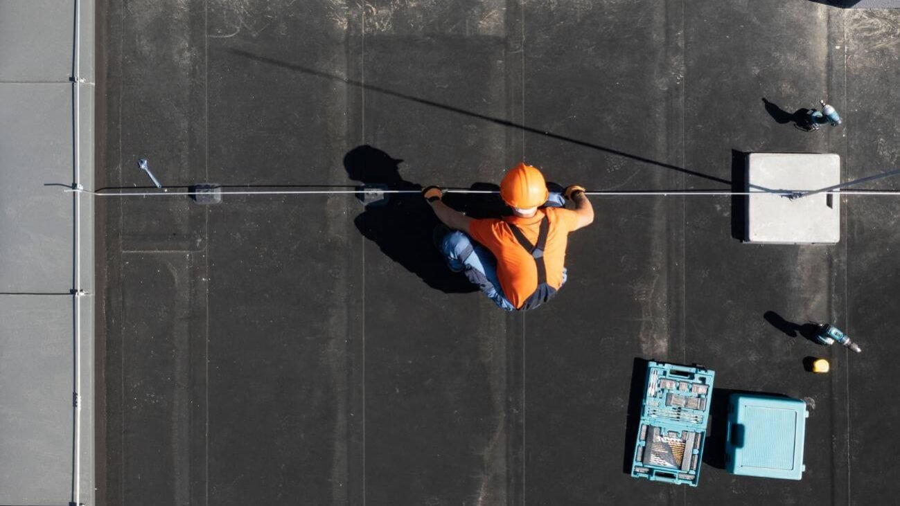 How to Repair a Flat Roof Expert Tips and Step-by-Step Guide A person Learning How to Repair a Flat Roof Expert Tips and Step-by-Step Guide