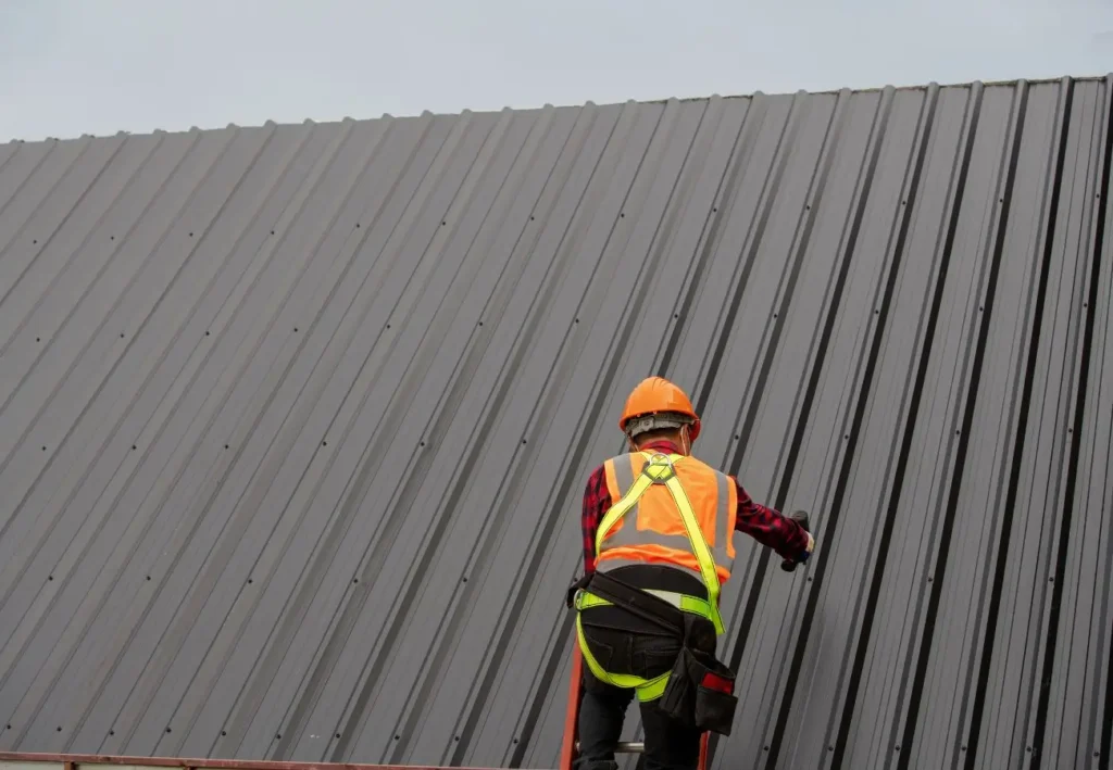 Repair metal roof doing by crew