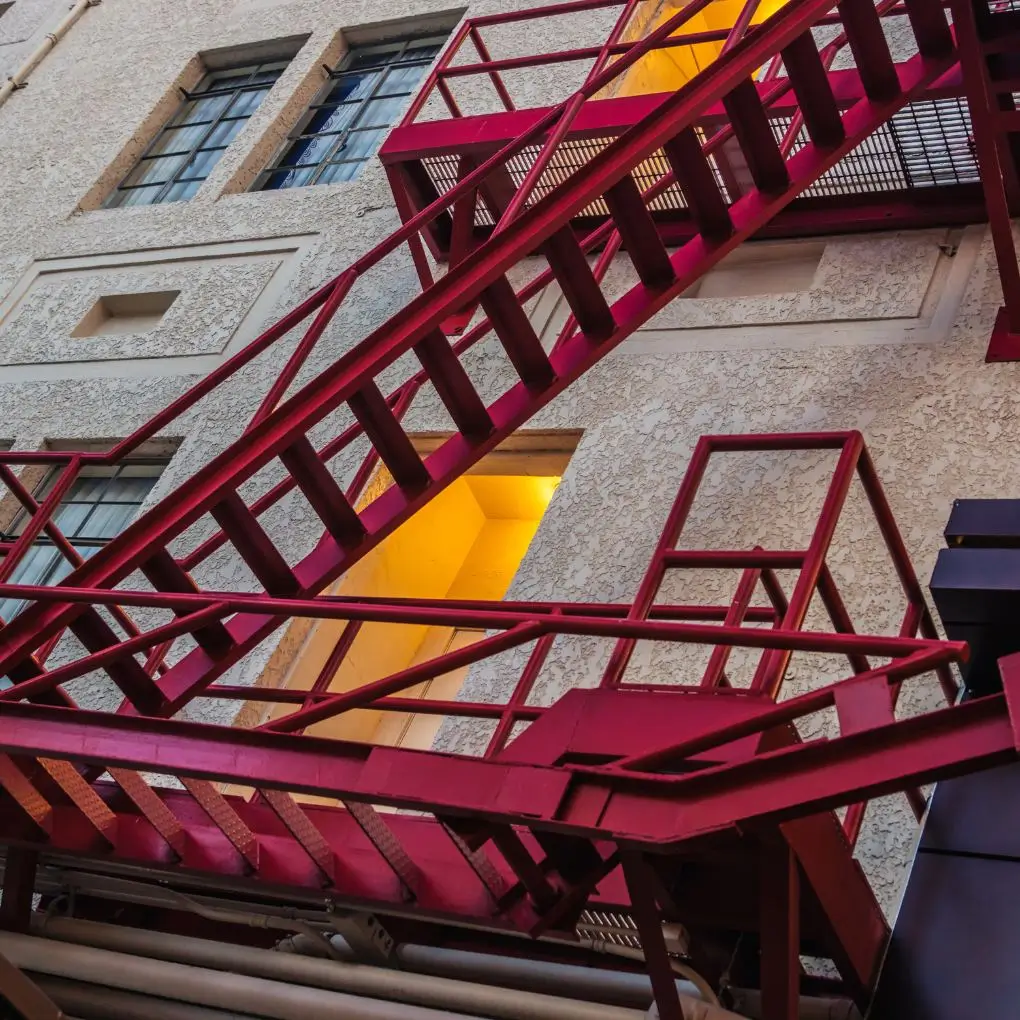 A red painted fire escape work done by Brick Tech Contracting Corp In NYC