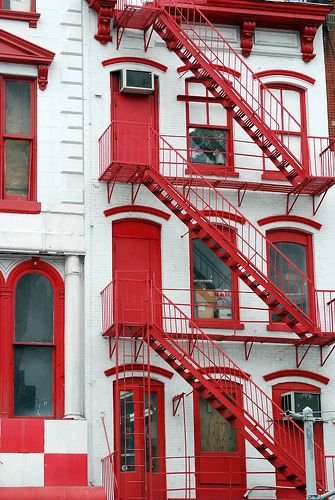 A red painted fire escape work done by Brick Tech Contracting Corp