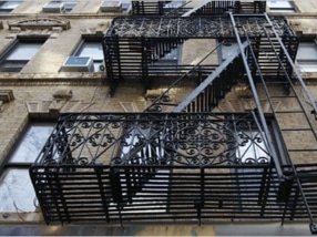 Scraping, priming, and painting fire escapes in New York City