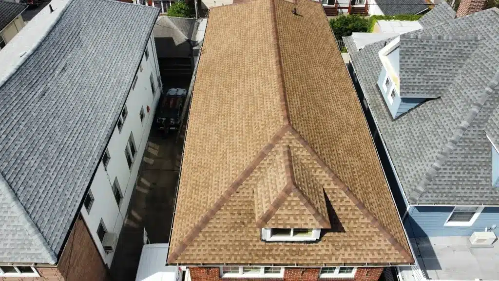 Gutter and downspout maintenance on a Brooklyn townhouse