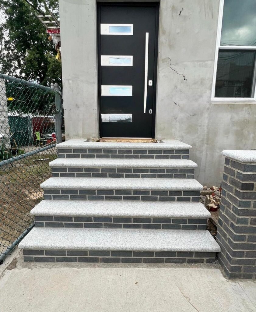 Newly rebuilt masonry stoop with stone steps in Park Slope, NY
