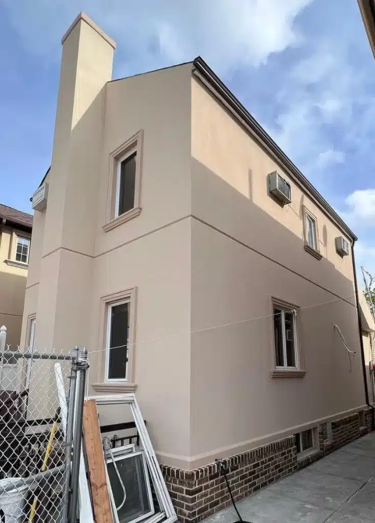 Stucco application on a residential building in Williamsburg, NY