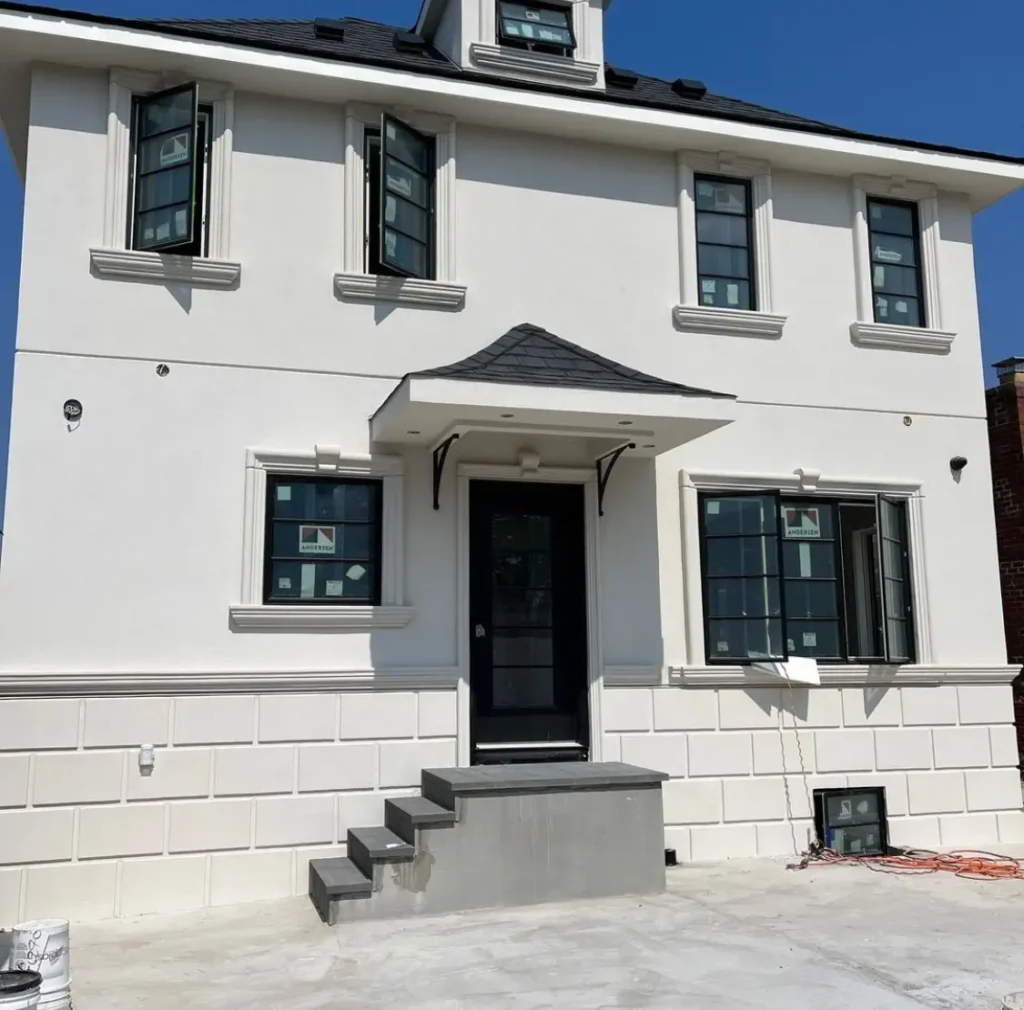 Stucco wall restoration on a Dyker Heights home