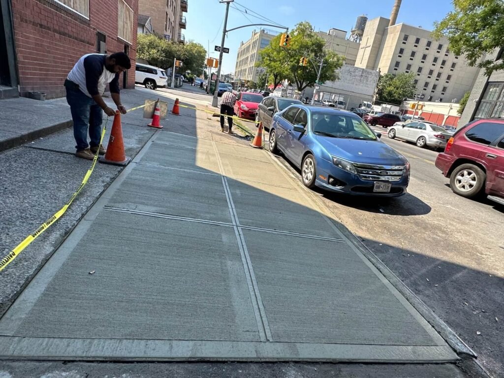 Uneven sidewalk slab correction project in Bushwick, NY