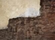 A detailed view of professional brickwork repair on an historic New York City building.