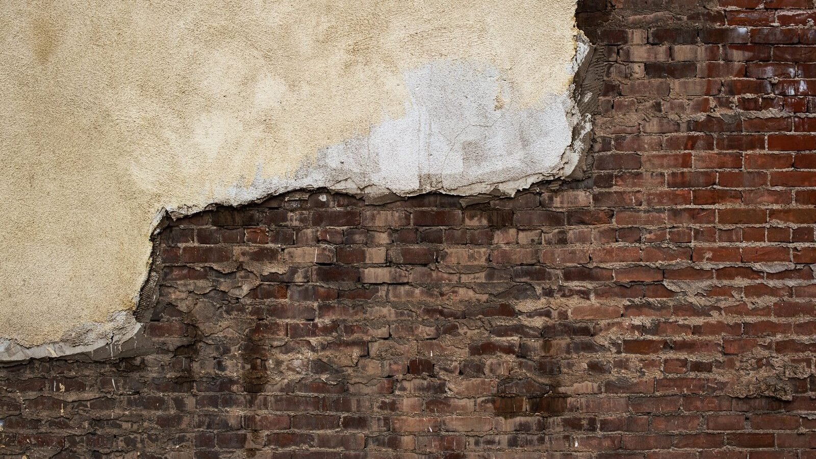 A detailed view of professional brickwork repair on an historic New York City building.