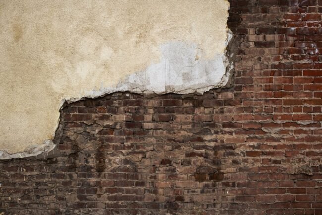 A detailed view of professional brickwork repair on an historic New York City building.