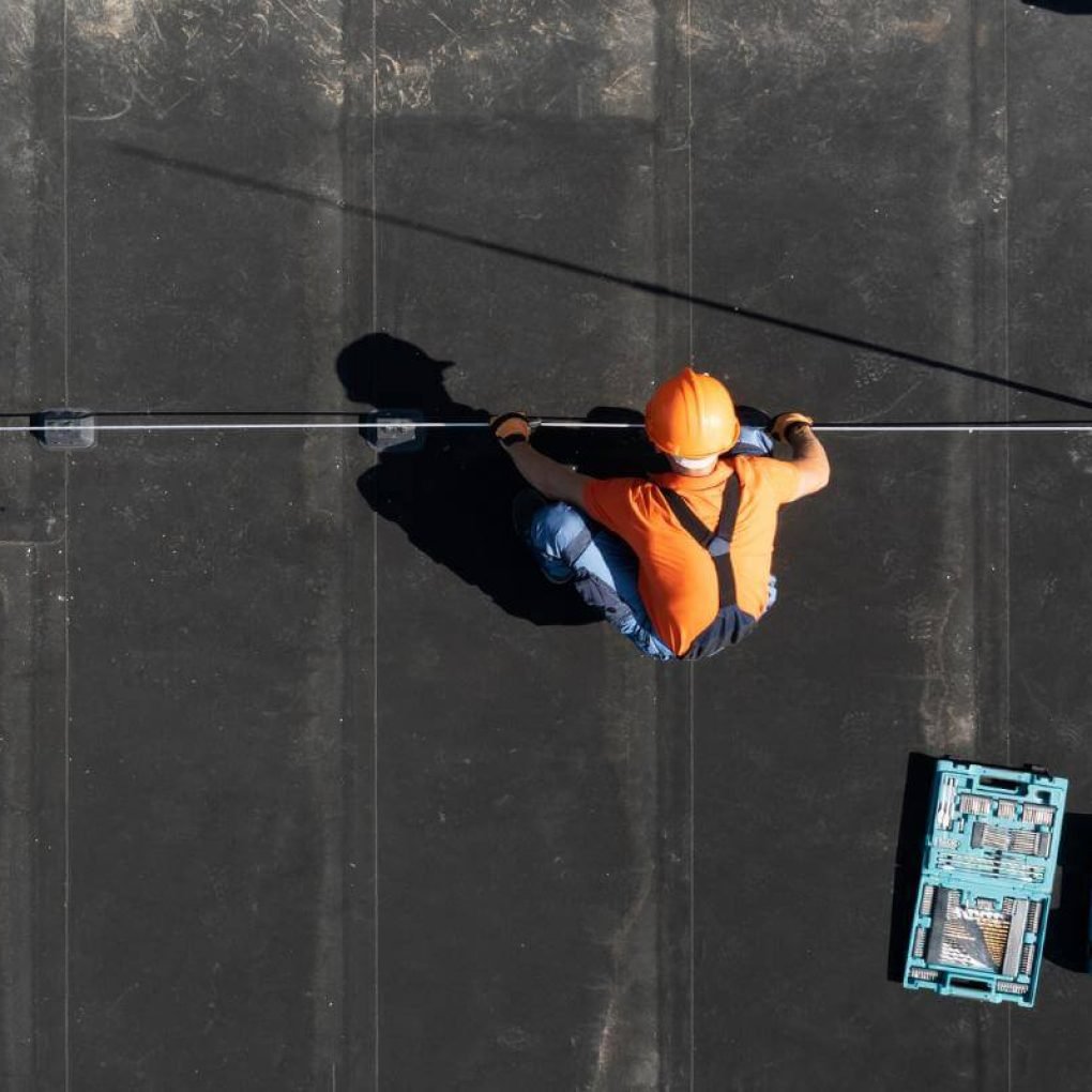 A person Learning How to Repair a Flat Roof Expert Tips and Step-by-Step Guide